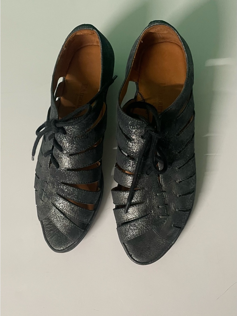 The L'Amour Des Pieds Bellina black metallic lace-up peep toe cage wedge sandal